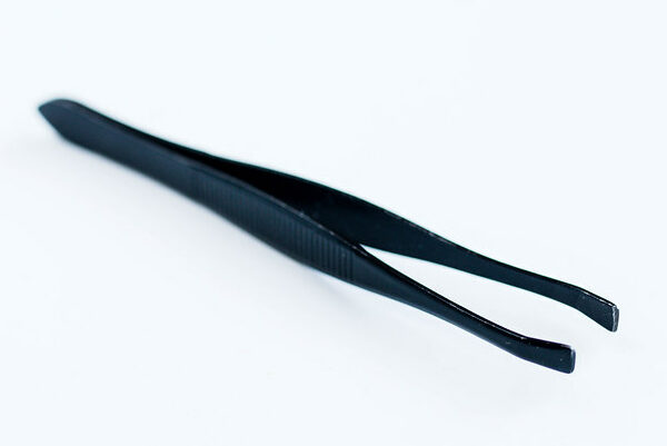 Black tweezers on white background.