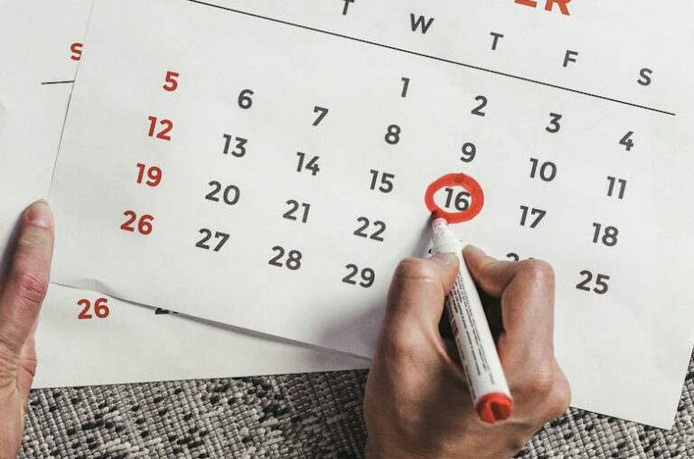 Person Encircling the Date on the Calendar