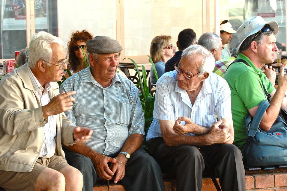 Elderly men in conversation