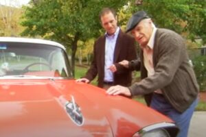 Elder father, son and their classic car